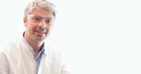 A young scientist explaining something about the content in two test tubes Stock Footage 48973930
