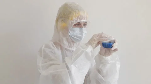 Young scientist holding container Video stock 64370416