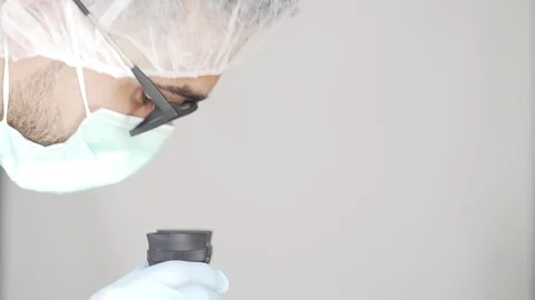 Young Scientist Looking Through a Microscope in a Laboratory. Stock Footage 128006514