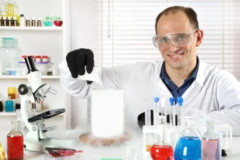 A young scientist makes experiments Stock Photos
