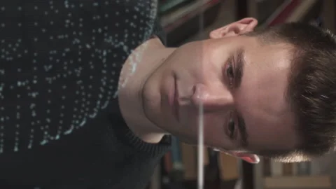 Young scientist or analytic working with earth model on transparent screen Stock Footage 204944863