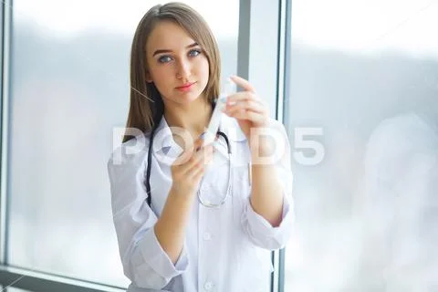 Young scientist pipetting in life science laboratory. Stock Photos