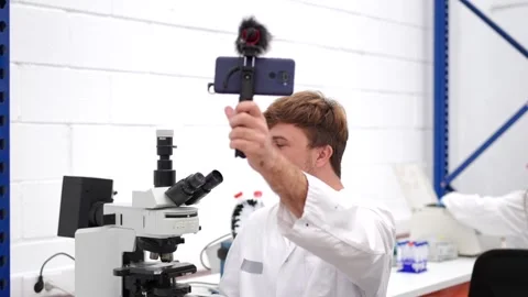 Young scientist recording tutorial for social media Stock Footage 255196452