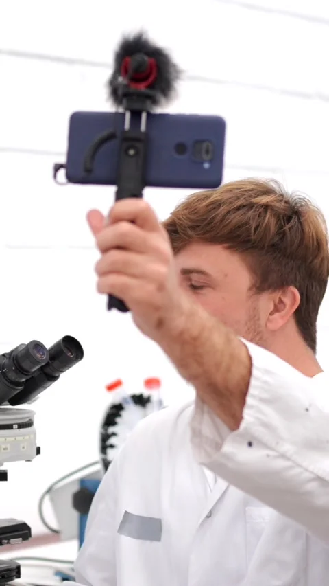 Young scientist recording tutorial for social media Stock Footage 257274243