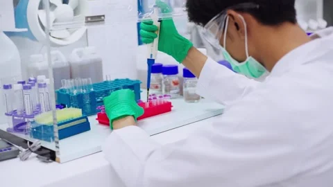 Young scientist using pipette transfer sample to Micro Centrifuge Tube for PCR t Stock Footage 131551019