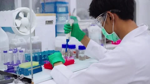 Young scientist using pipette transfer sample to Micro Centrifuge Tube for PCR t Stock Footage 133444876