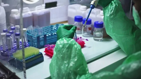 Young scientist using pipette transfer sample to Micro Centrifuge Tube for PCR t Stock Footage 134273757