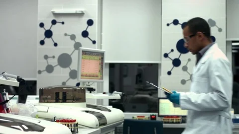 Young Scientist Working With Blood Test Tubes at the Modern Laboratory Stock-Footage 71780581