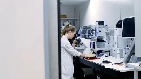 Young scientist working in modern biological laboratory Stock Footage 71680922