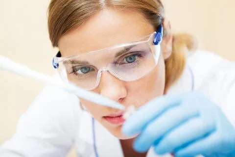Young scientist working with samples in lab. Stock Photos