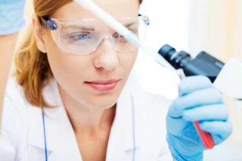 Young scientist working with samples in lab. Stock Photos