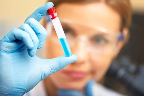 Young scientist working with samples in lab. Stock Photos