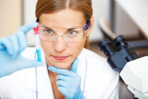 Young scientist working with samples in lab. Stock Photos
