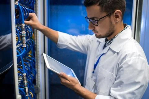 Young Scientist Working with Supercomputer Foto stock