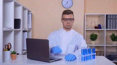 Young scientist works with test tubes Stock Footage 113445322