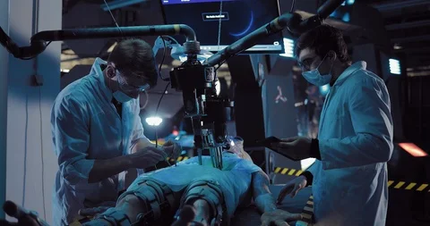 Young scientists carry out the operation of alien existence with the help of Stock Footage 103868607