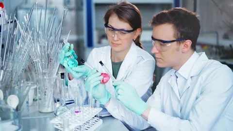 Young scientists working in modern biological lab Stock Footage 85328096