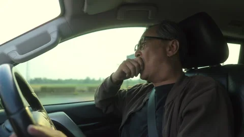 Young Senior old man driver was drowsy. Grandfather he yawned and was about to. Stock Footage 274406558