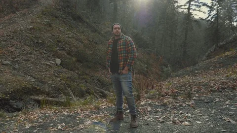 Young Serious Man Standing in Forest. Traveling Concept People in Nature. Stock Footage 130060910