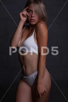 Foto de Beautiful young sexy woman in underwear do Stock