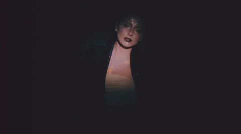Young sexy brunette over black background with smoke Stock Footage