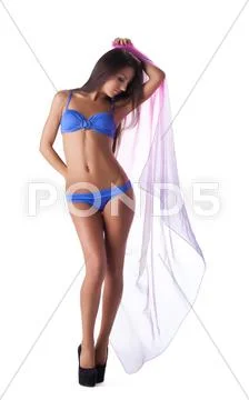 Young sexy girl in blue bikini swimsuit with cape Stock Photos