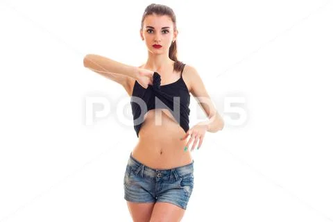 Image of hot babe posing in bra and denim shorts Stock Photo
