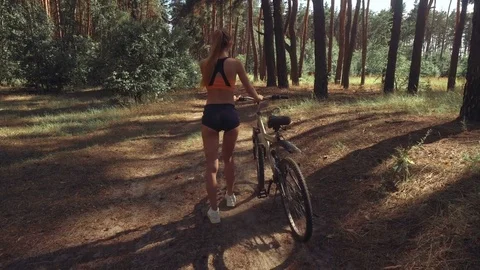 Young sexy lady with a Bicycle Stock Footage