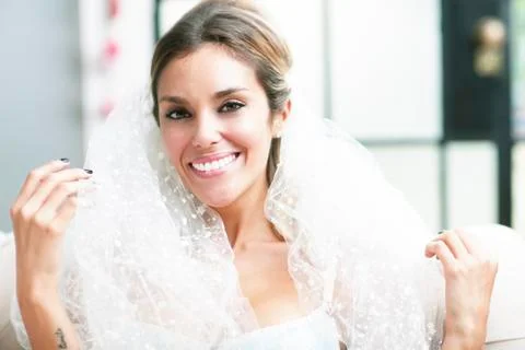 Young sexy romantic latin bride in erotic lingerie smiling Stock Photos