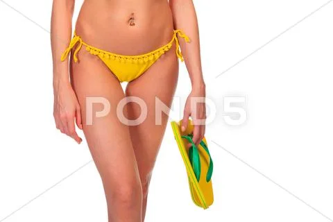 Young sexy woman in yellow swimsuit Stock Photos