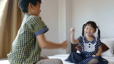 Young siblings playing together Stock Footage 79925186