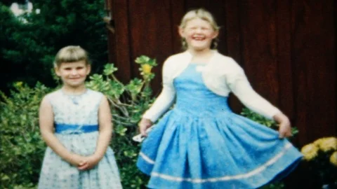 Young sisters pose for photos on Easter morning 1950s vintage home movie 5296 Stock Footage 101622965