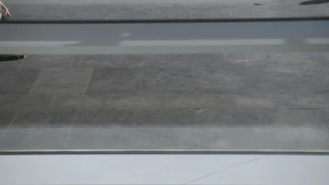 Young skateboarder lands a difficult trick while skating in the urban skate park Stock Footage 106664172