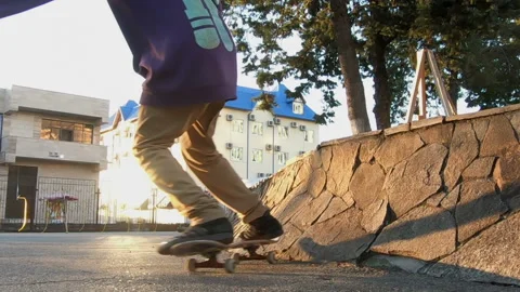 Young skateboarder performs a trick on the curb Video stock 93823291