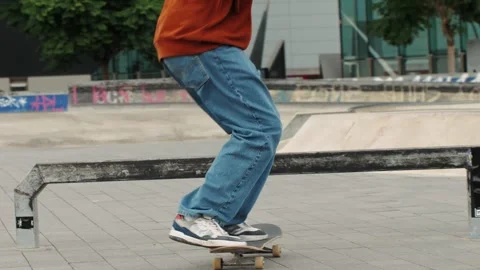 Young skater making 360 flip jump, performing kickflip trick, skateboarder Stock Footage 274085499