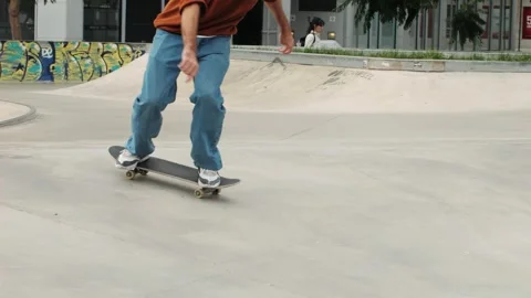 Young skater making 360 flip jump, performing kickflip trick, skateboarder Stock Footage 274085784