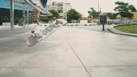 Young skater making 360 flip jump, performing kickflip trick, skateboarder Stock Footage 284150774