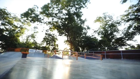 Young skater performs tricks riding scooter on modern ramp Stock Footage 114261980