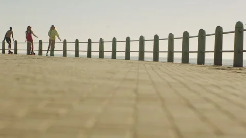 Young skaters on the broadwalk Stock Footage 279377259