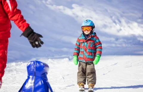 Young skier looking at ski instructor Stock Photos