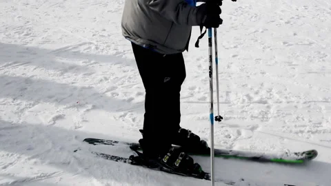 A young skier is making various moves while he tries to warm up. Stock Footage 152688786