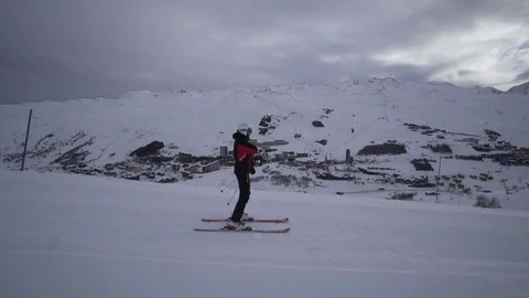 Young Skier man is Carving Down the Snowy Slope Wanderlust Stock Footage 84764894