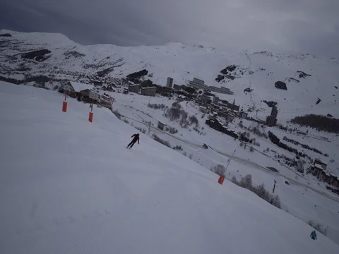 Young Skier man is Carving Down the Snowy Slope Wanderlust Stock Footage 84766876