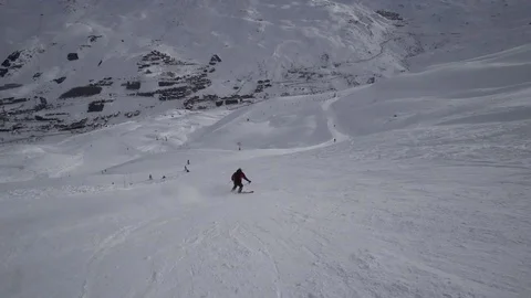 Young Skier man is Carving Down the Snowy Slope Wanderlust Stock Footage 84768017