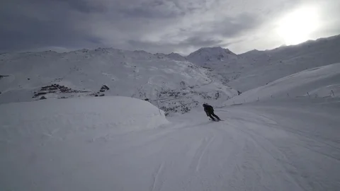 Young Skier man is Carving Down the Snowy Slope Wanderlust Stock Footage 84769304
