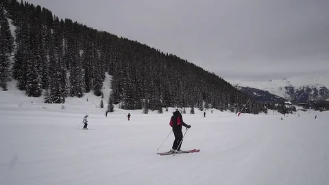 Young Skier man is Carving Down the Snowy Slope Wanderlust Stock Footage 84771081