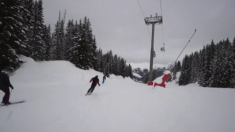 Young Skier man is Carving Down the Snowy Slope Wanderlust Stock Footage 84772102