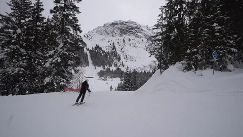 Young Skier man is Carving Down the Snowy Slope Wanderlust Stock Footage 84772831