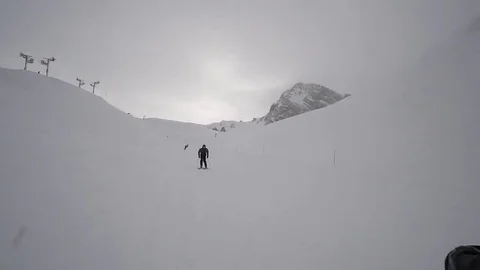 Young Skier man is Carving Down the Snowy Slope Wanderlust Stock Footage 84773623