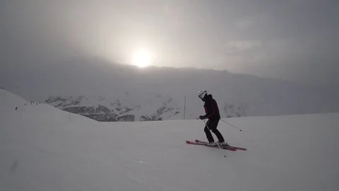 Young Skier man is Carving Down the Snowy Slope Wanderlust Stock Footage 84775894